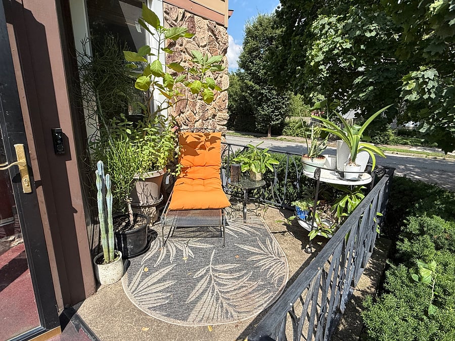 Exterior front porch seating with plants