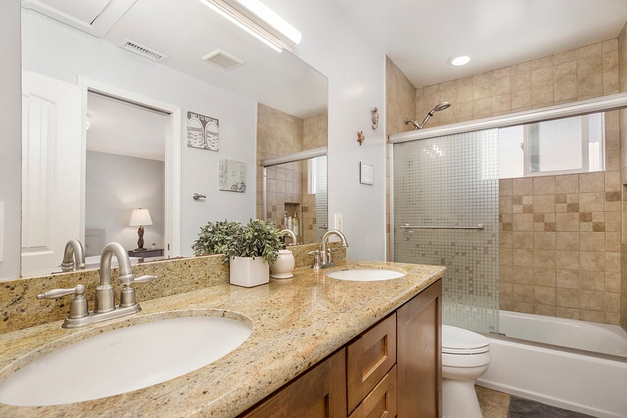 Second bathroom w/ tub & double vanity.