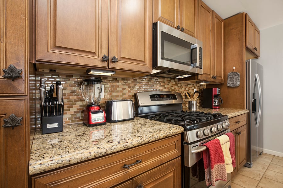 Kitchen with top of the line appliances and cooking utensils. Permit #str21-1275