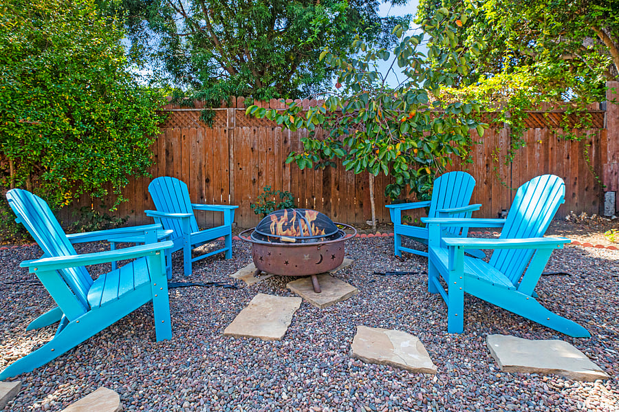 Beautiful backyard with Fire pit and outdoor sitting & dining area. Permit #str21-1275.