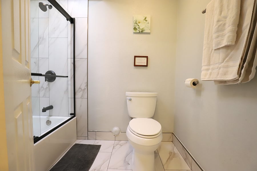 Refresh and recharge in the master bathroom, designed to provide a comfortable and functional space for your daily routines during your stay.