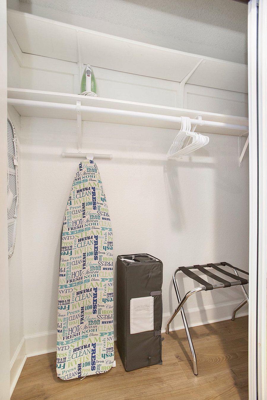 The house includes a Pack 'n Play, a vacuum, and an iron with an ironing board for your convenience.