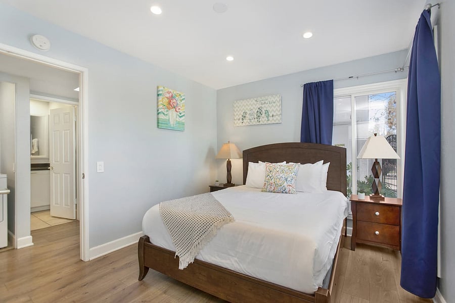 Unwind after a long day in this inviting bedroom with a queen-size bed, offering the perfect balance of comfort and space for a peaceful and refreshing night's rest.