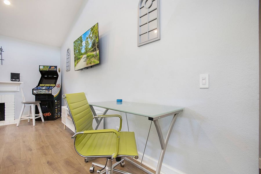 Computer workstations are in the living room and master bedroom.