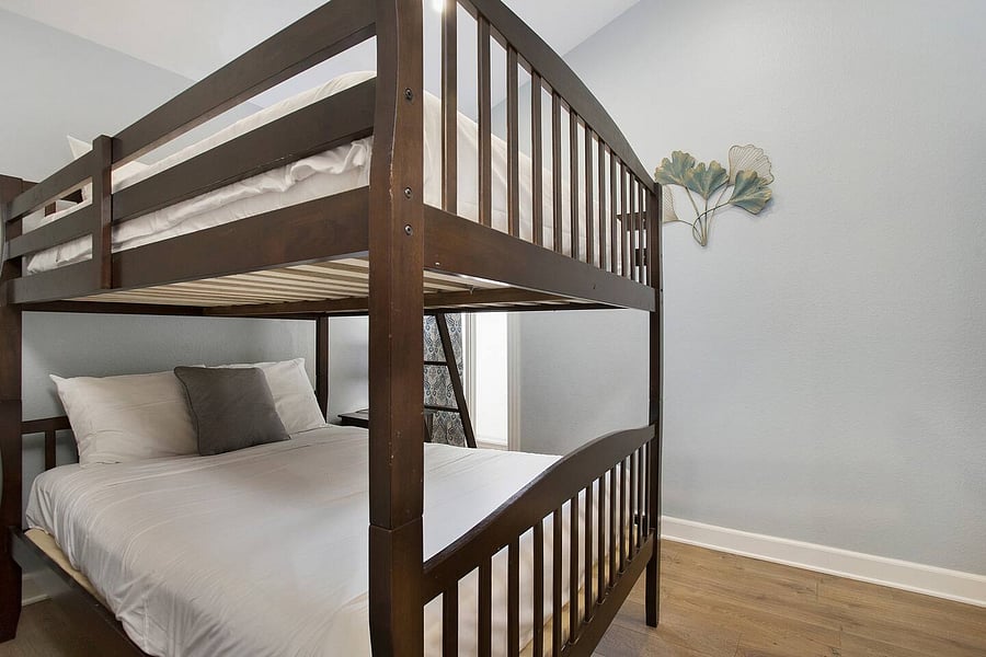 Designed with both comfort and practicality in mind, the full-size bunk bed offers a convenient sleeping arrangement for guests who want to stay together under one roof.