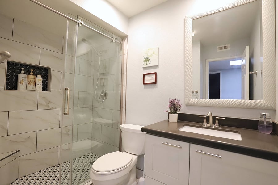 Step into comfort with this well-maintained walk-in shower, perfect for washing away the day's activities and enjoying a refreshing moment of relaxation.