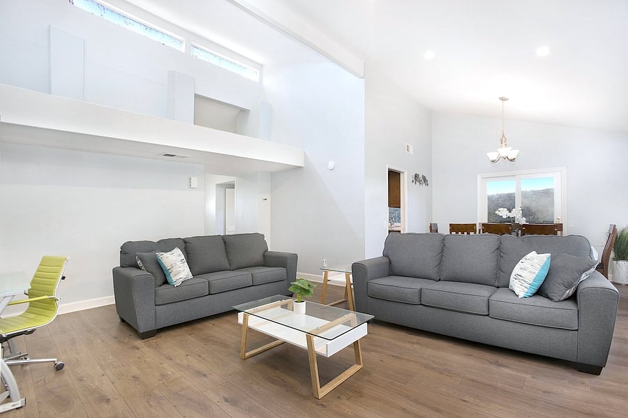 A clean, cozy, and functional living area that offers guests a comfortable place to rest, socialize, and enjoy a relaxing home-away-from-home experience.