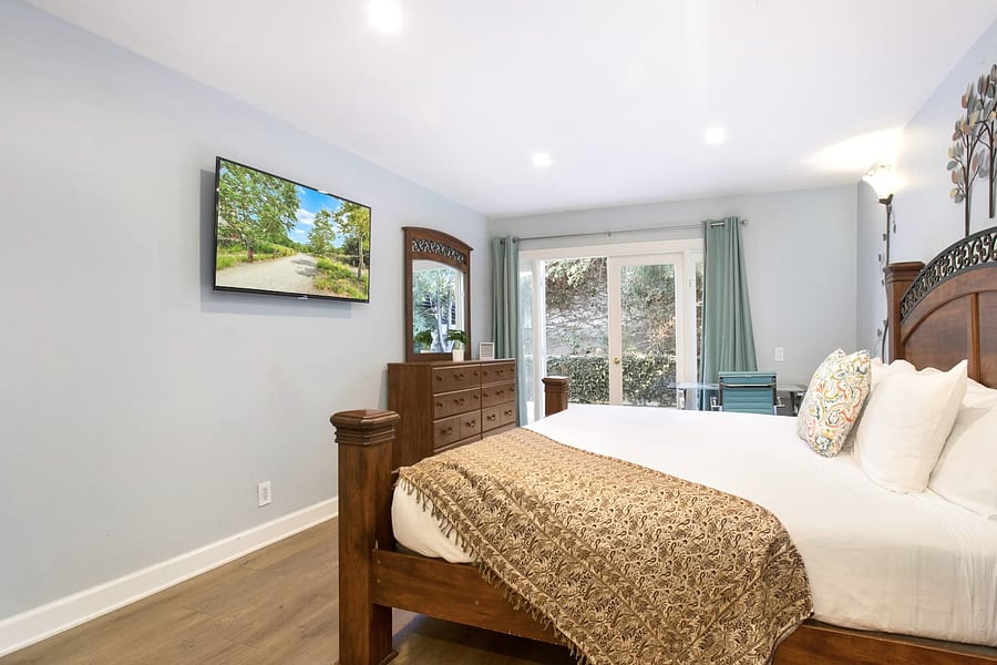 King bed + Smart TV & computer desk/chair in the master bedroom
