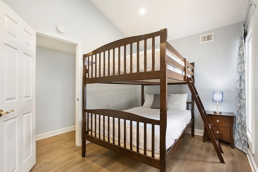 Enjoy a comfortable and space-saving sleeping setup with a full-size bunk bed, offering a convenient option for guests traveling together while making the most of the room.