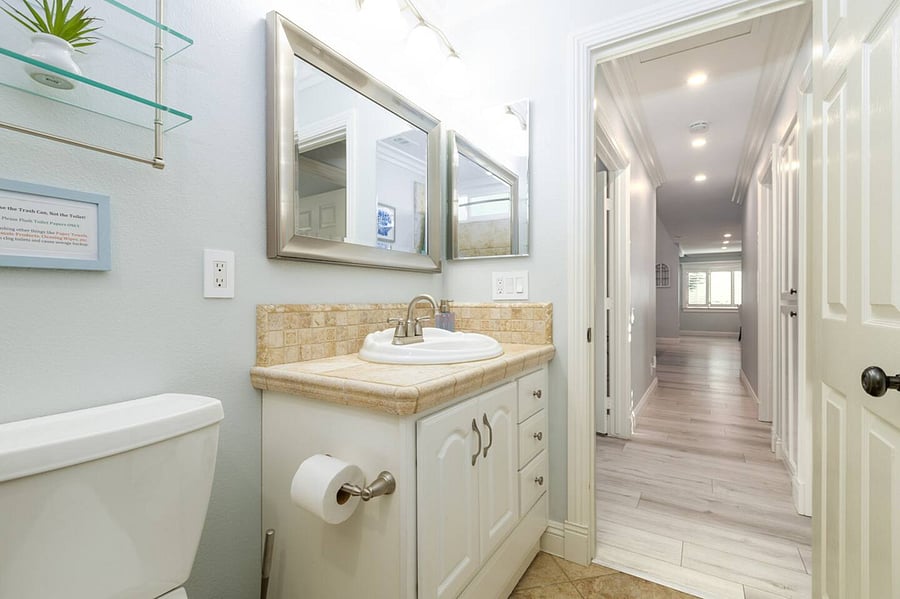 Second bathroom with a tub.