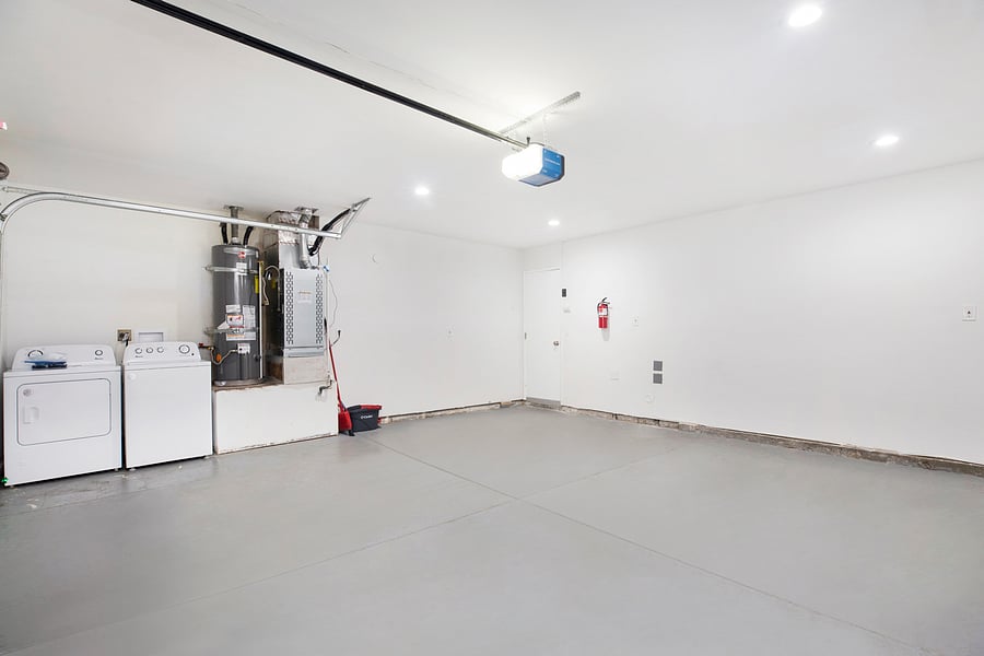 Spacious attached 2-car garage with EV charger, washer/dryer, and plenty of room for parking or storage!