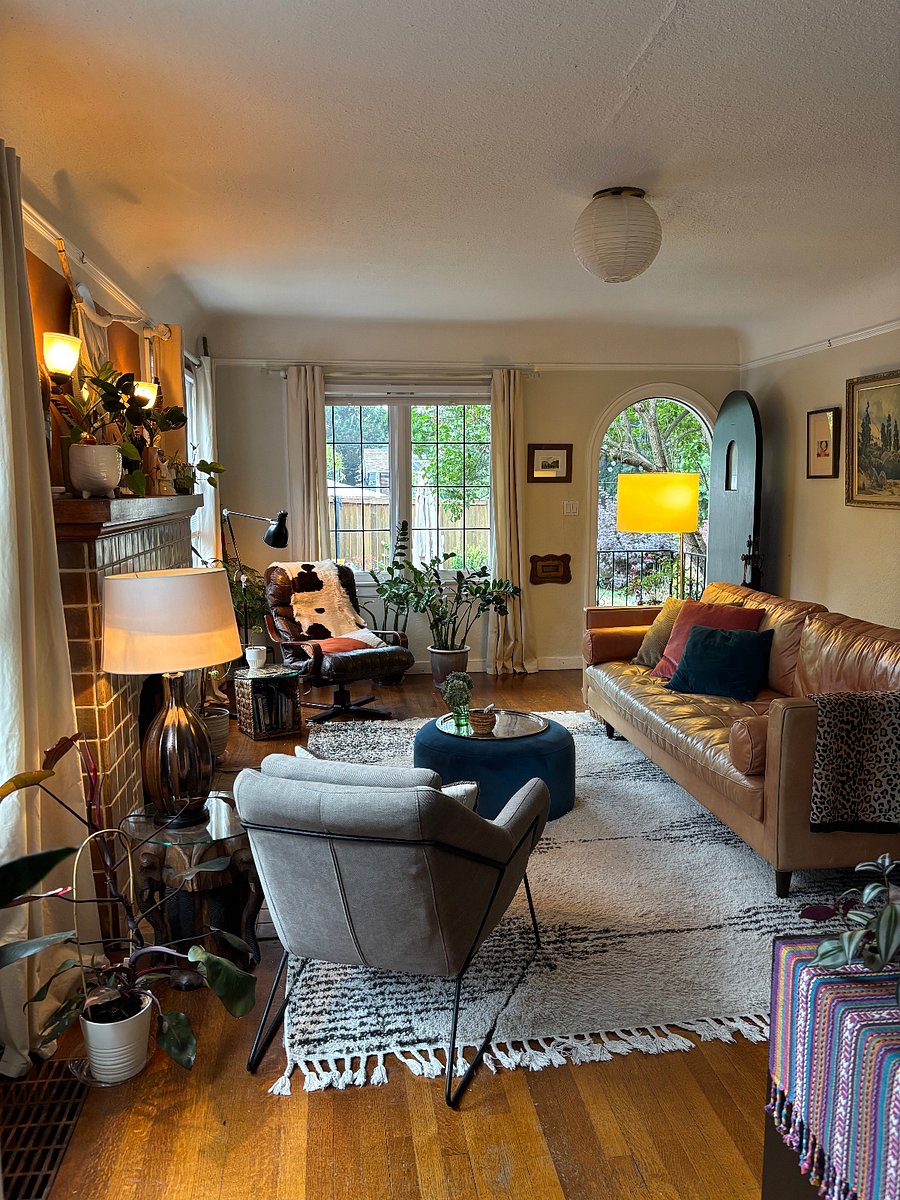 Living room from kitchen toward front door & yard