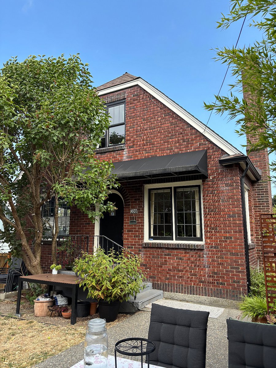 Front door facing nw 62nd ave, inside fenced yard