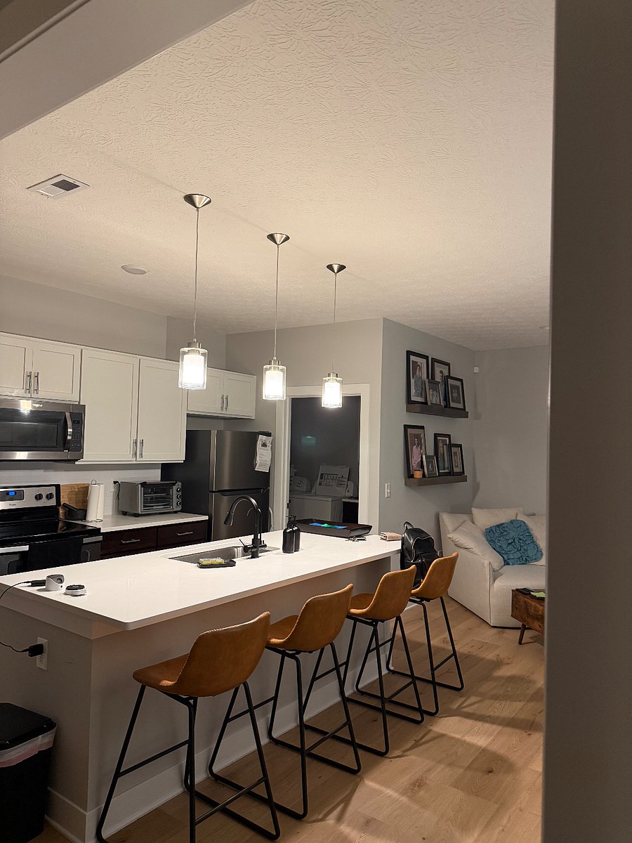Kitchen with island and bar stool seating