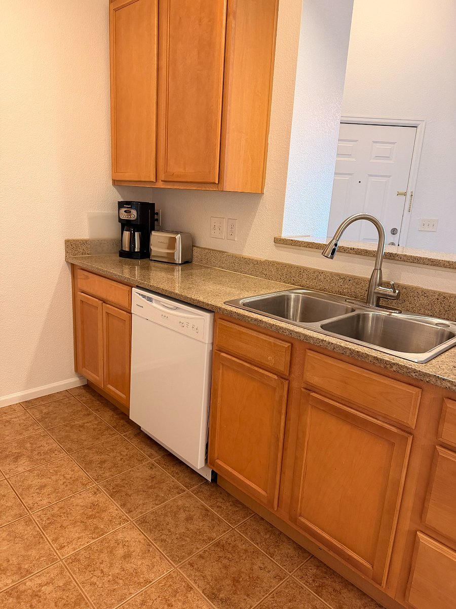 Kitchen with granite counter tops and dishwasher