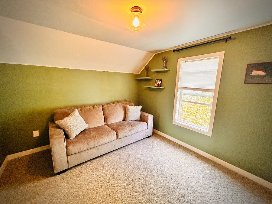 Guest bedroom sleeper sofa that converts into a queen sized bed 
