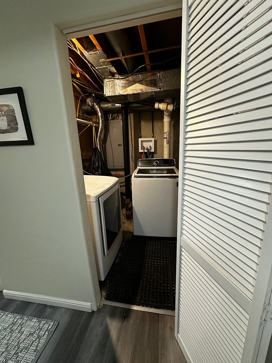 Laundry area off kitchen hallway.