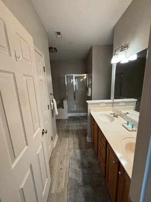 Primary ensuite bathroom with shower and full tub