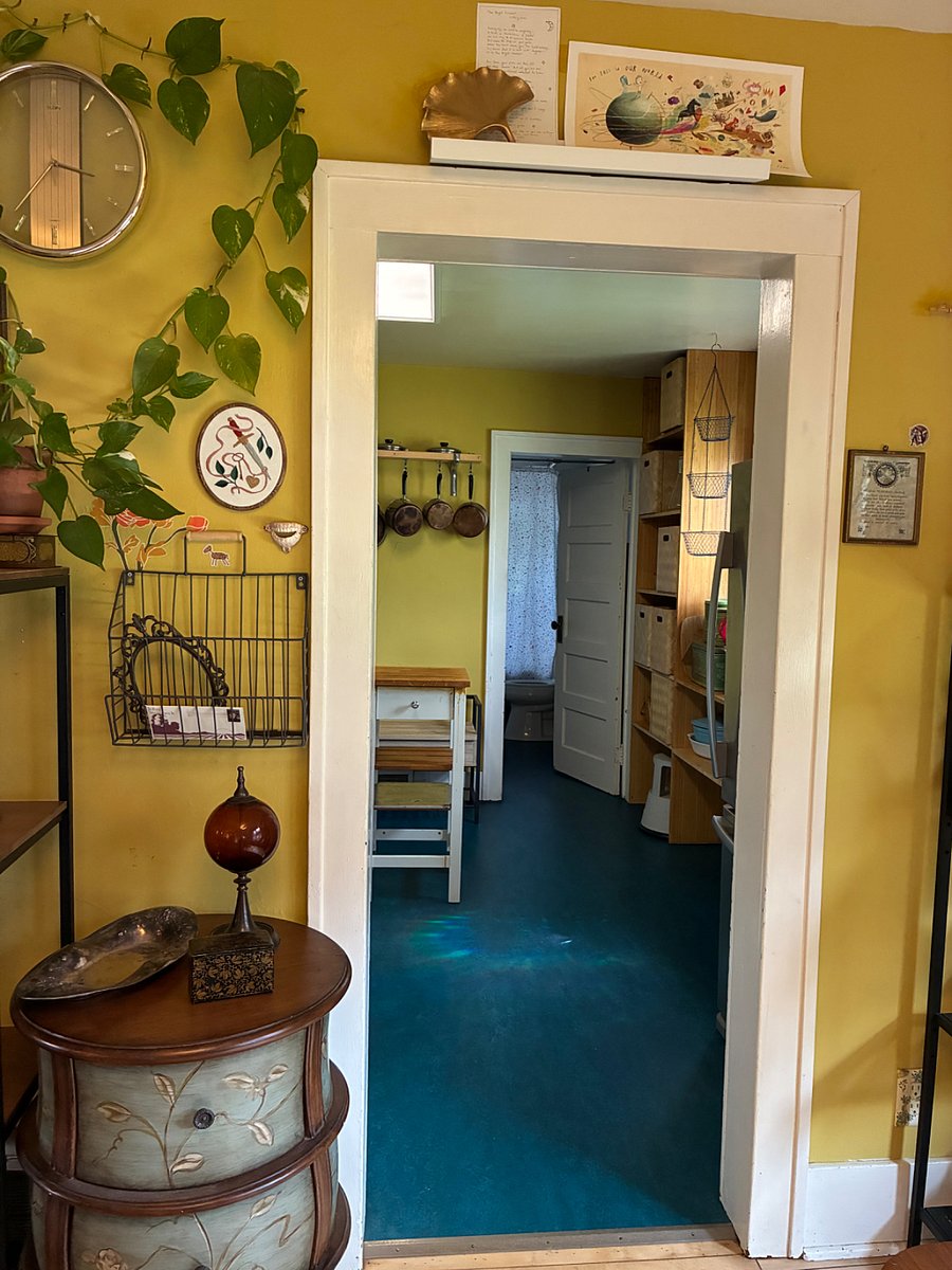 From the dining room, a view into kitchen and door to bathroom.