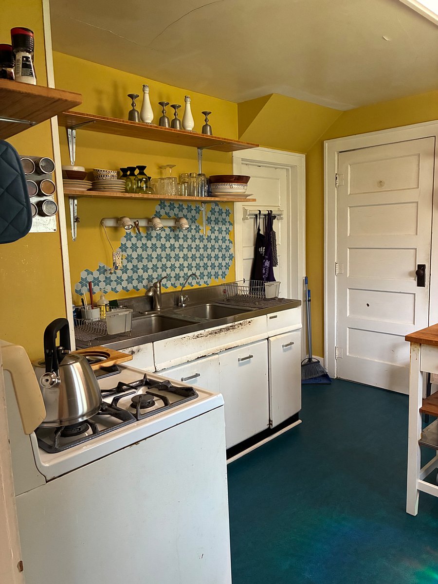 Full kitchen with gas range and oven, vintage sink, and filtered water built-in.