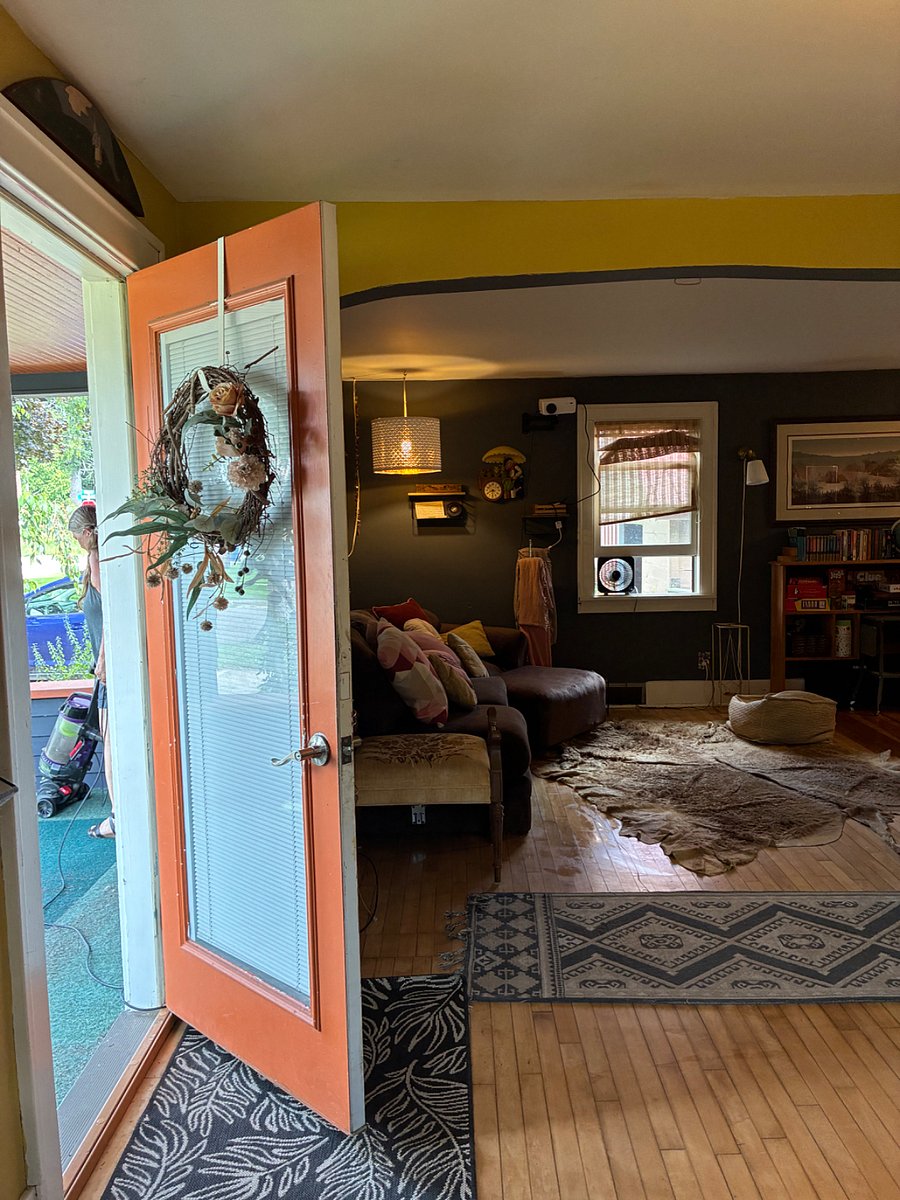 Entering the front door, the living room is to the left.