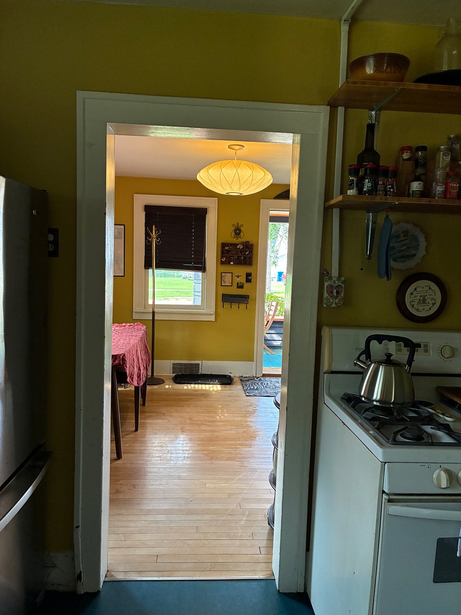 View through the house: from the bathroom, into the kitchen, through the front room, onto the porch.