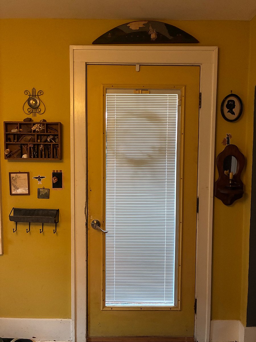 Door to the porch. Every corner of the Townhouse features artful decor.