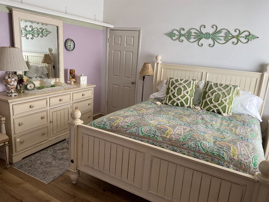 Master view of purple bedroom with King size bed.