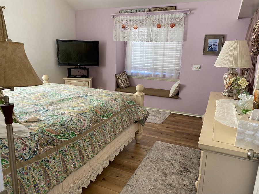 View of Purple room with Smart TV.