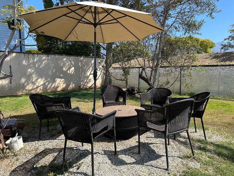 Bacyard sitting area with fire pit.