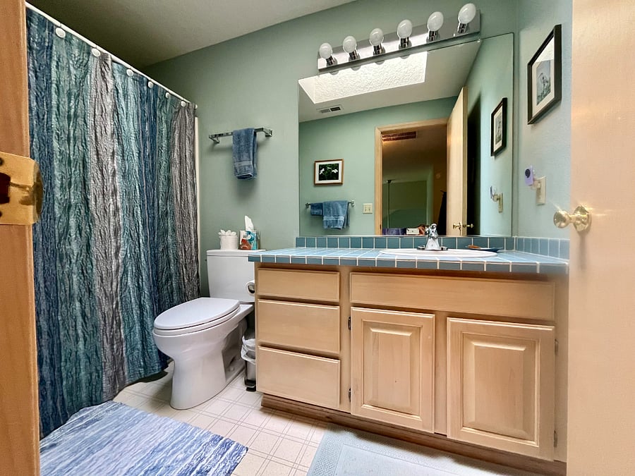 guest bathroom with tub and shower
