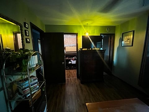 View of primary bedroom from bed. 