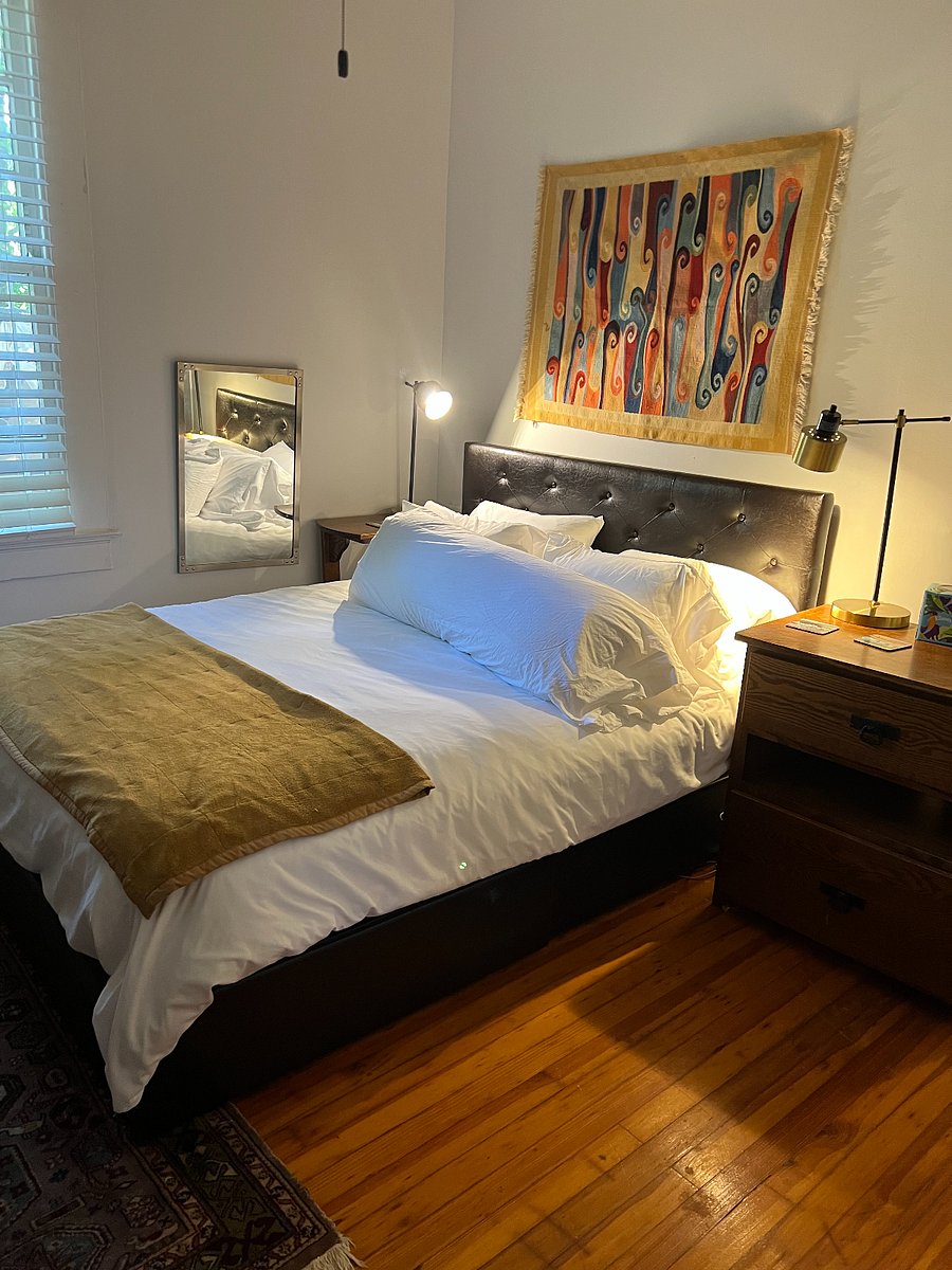 Main bedroom with a queen bed. Extra sheets are in each closet.