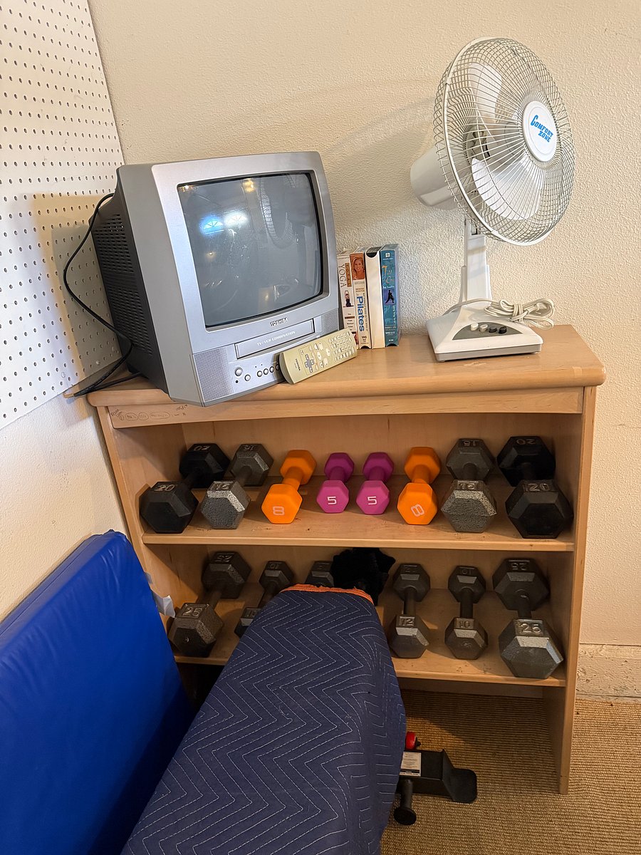 Gym style weight bench & handheld weights, Cassette TV with workout tapes, Yoga mat and portable plastic table w/4 chairs for patio dining