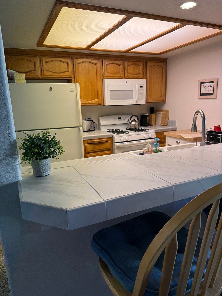 Tiled countertop seats 3 people