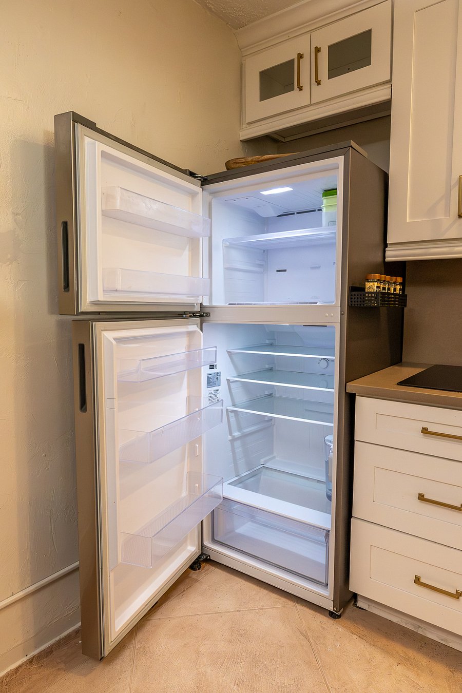 Pristine, full-size Samsung fridge ready for your weekly grocery haul and meal prep.