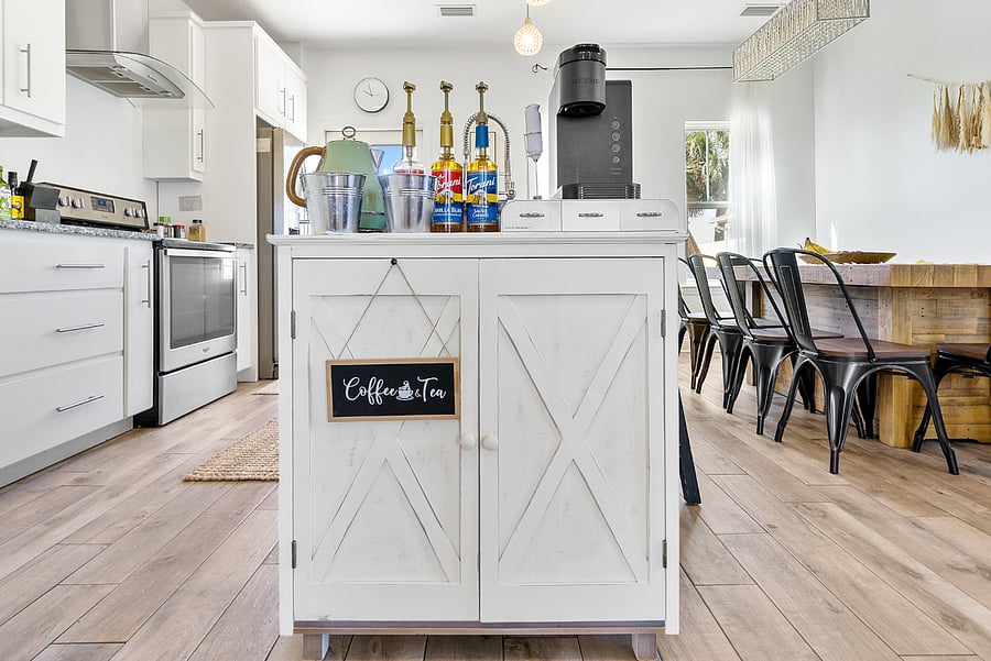 coffee bar with syrups and tea kettle