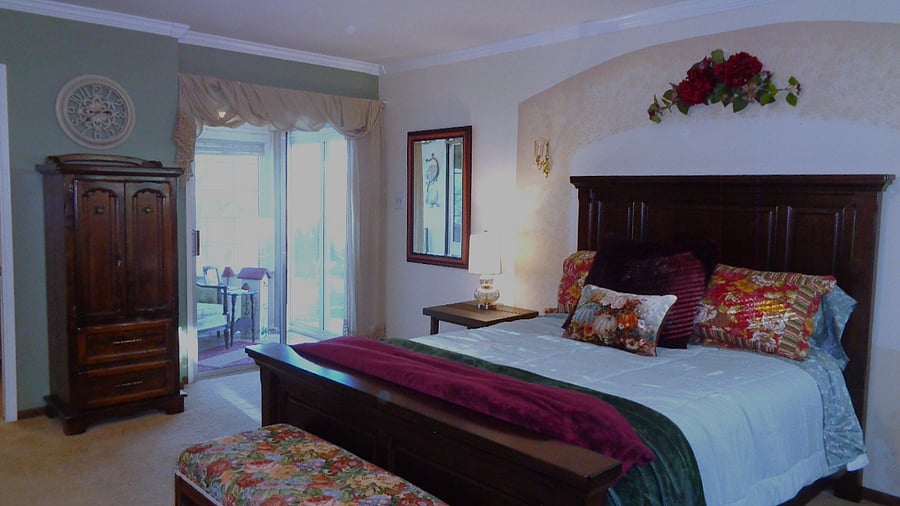 The primary bedroom has its own reading nook with its own slider door entrance. Huge mirrored double closets are a plus. This room has its own desk.