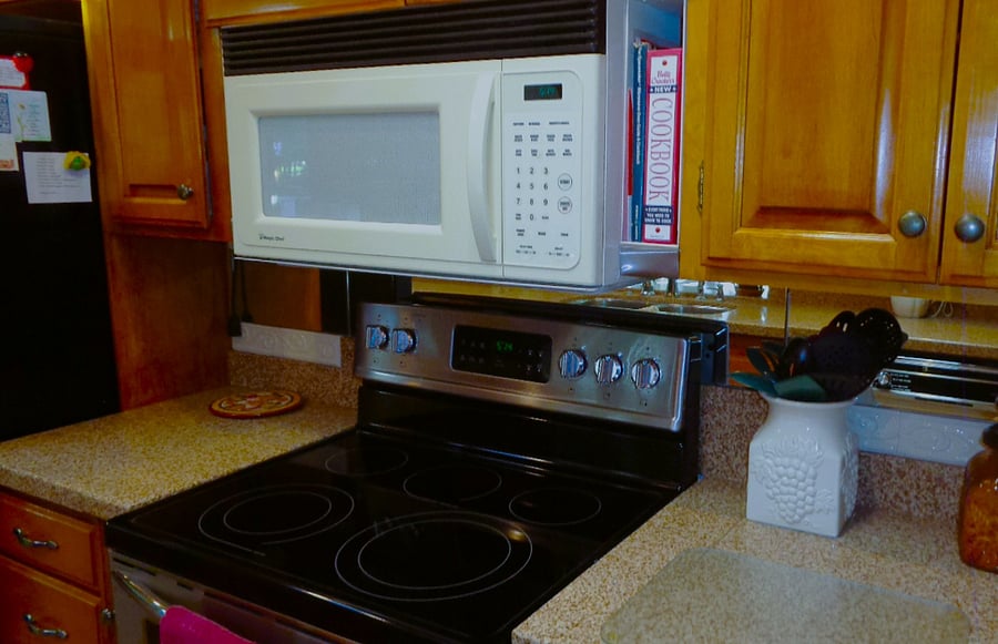 Pristine electric stovetop as well as a large microwave is available for cooking meals.