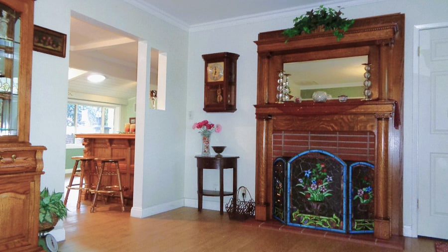 The den and living room both have working fireplaces.
