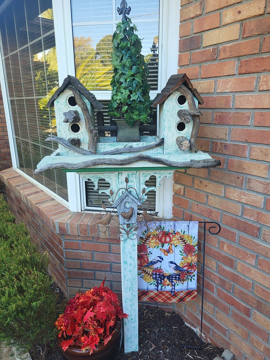 Your front door has a welcoming garden view with decor that will change with the seasons.