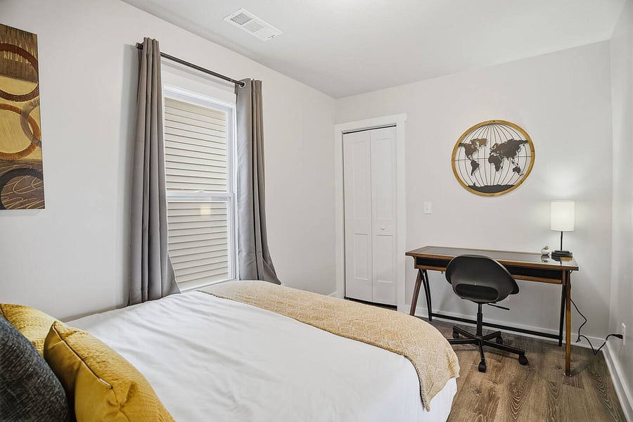 Spacious guest bedroom with desk!