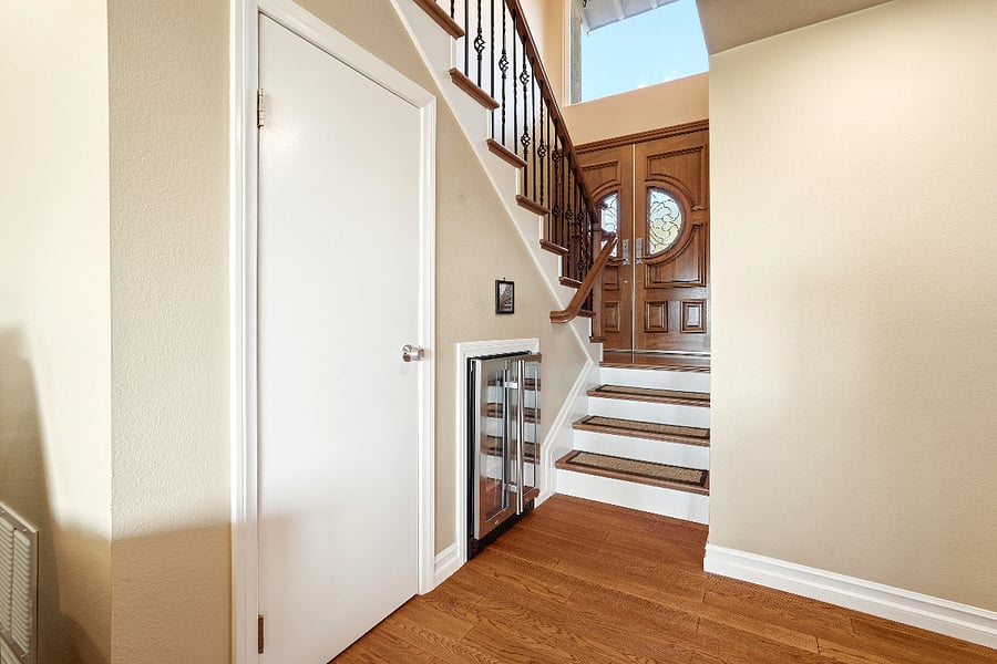 Entrance with closet and wine fridge
