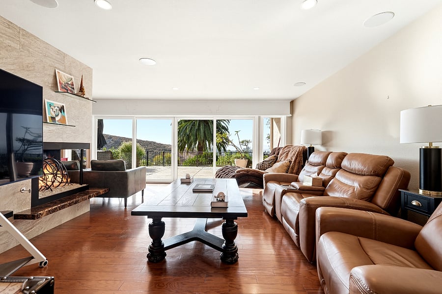 Living Room overseeing the vista patio, fruit trees and panaramic views beyond