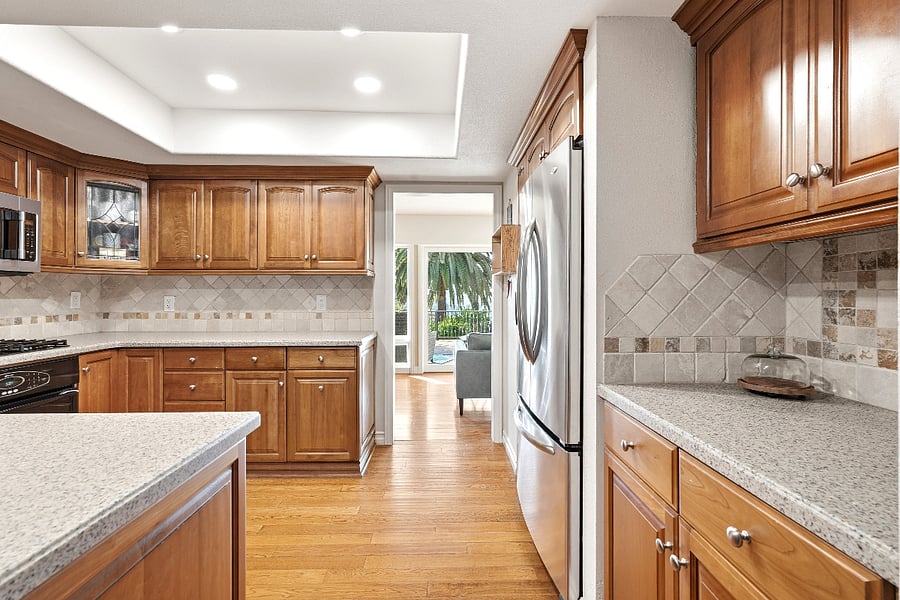 Kitchen looking into the Dining Room on one side and the vista patio with panoramic views on the other