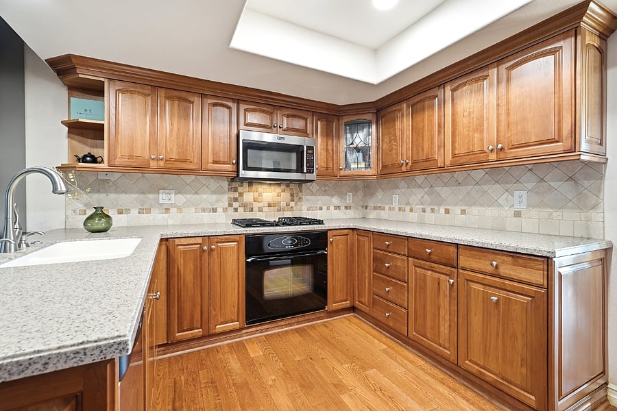 Kitchen with stove, oven, microwave, full fridge, dual sink with garbage disposal