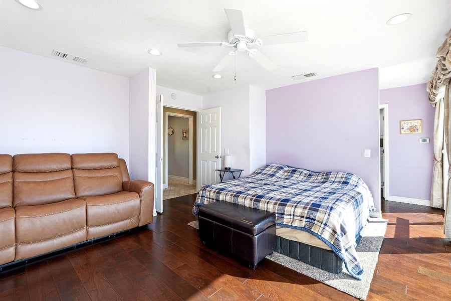 Primary bedroom featuring a large balcony with panoramic views, ensuite bathroom with walk-in shower and custom walk-in closet