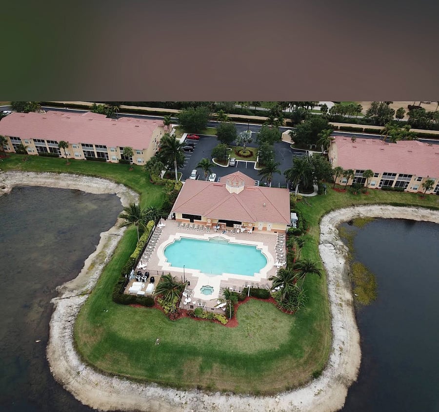 pool, spa, and clubhouse from above