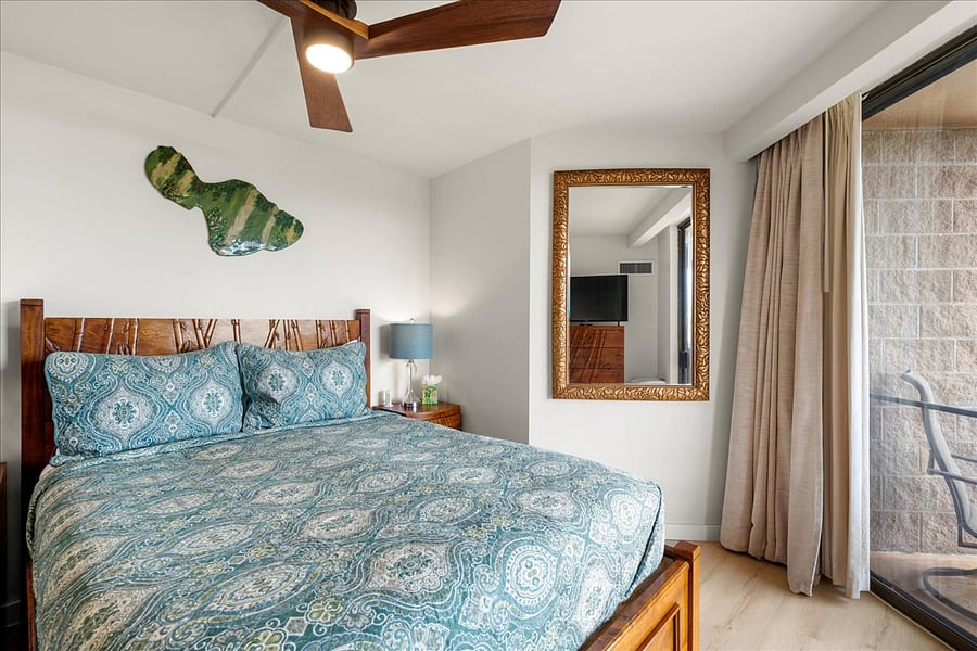 Drift off to sleep in a cozy king bed wrapped in soothing island tones. Thoughtful wooden accents create a peaceful retreat after a day of exploring.
