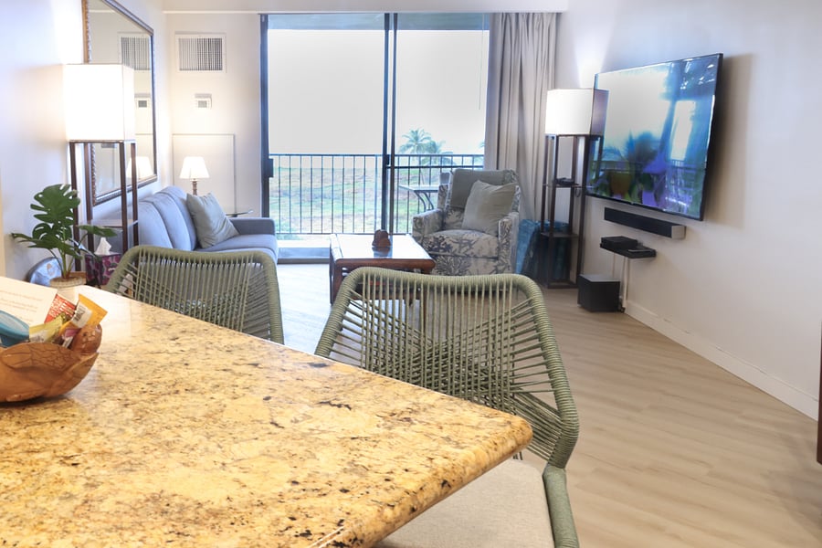 Sunlit, airy, and designed for total relaxation. Step inside to an open-concept living space that flows right out to the lanai and ocean breeze.